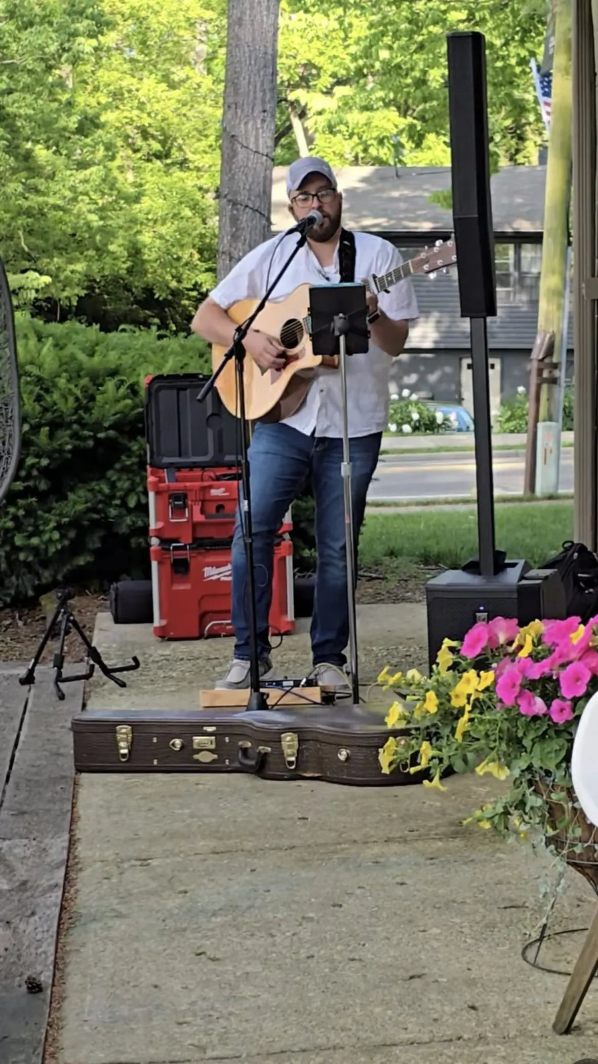 Tommy Renfro playing an acoustic set on a patio